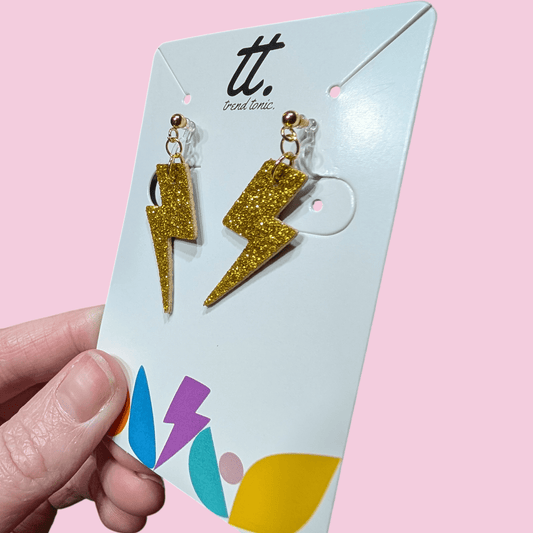Clip on mini gold glitter cork lightning bolt earrings - Trend Tonic