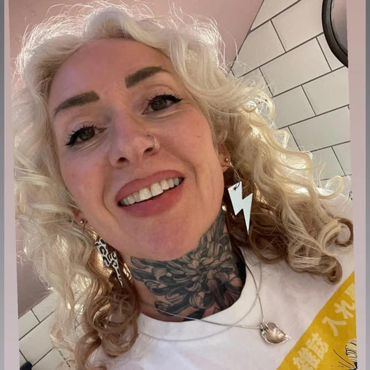 a woman with a tattoo on her neck