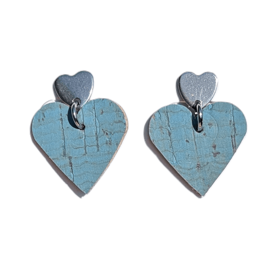 a pair of blue heart shaped earrings
