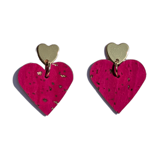 a pair of heart shaped earrings