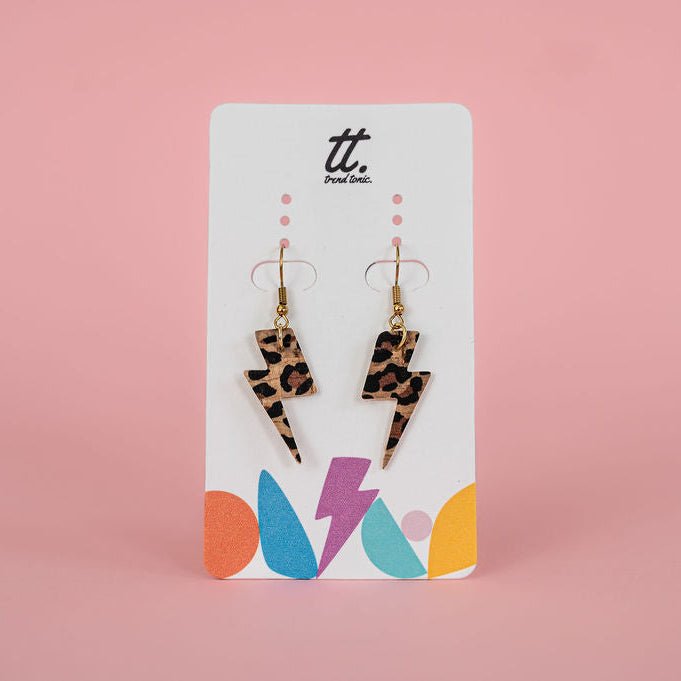 a pair of earrings on a card