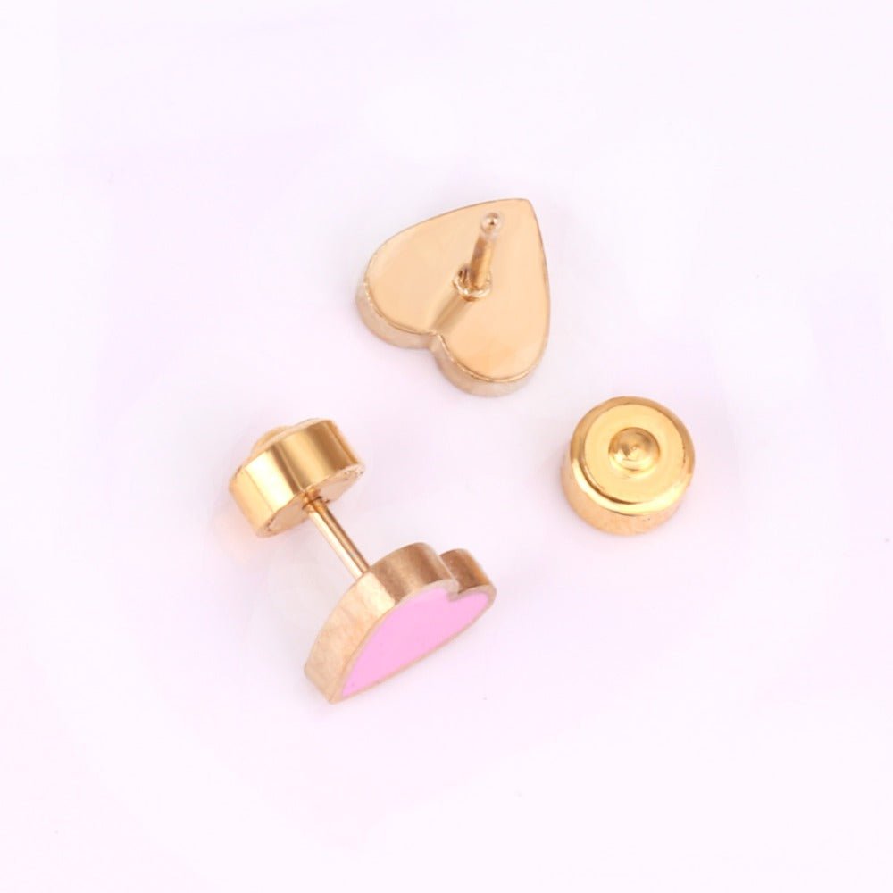 a pair of gold earrings
