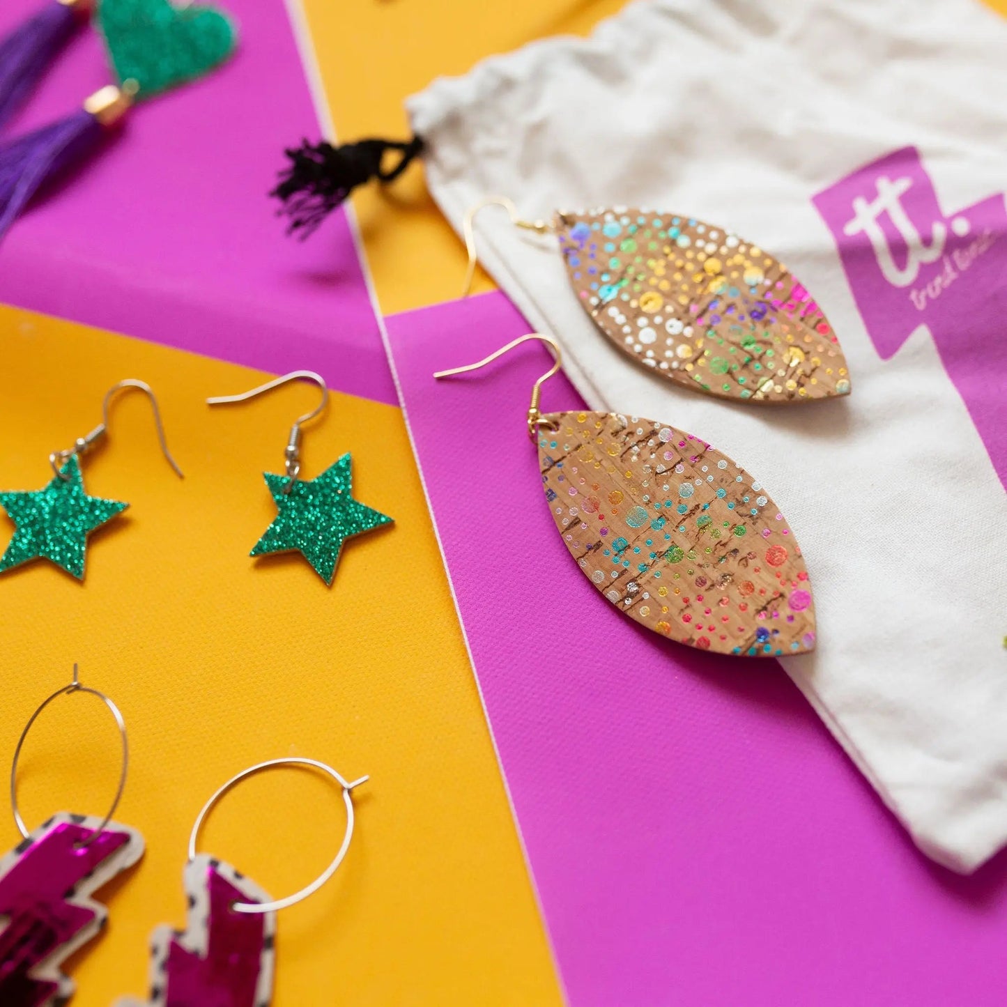 a group of earrings and a bag