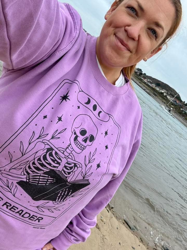 The reader skeleton tarot sweatshirt
