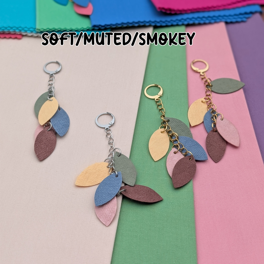 a group of colorful paper with leaves on it