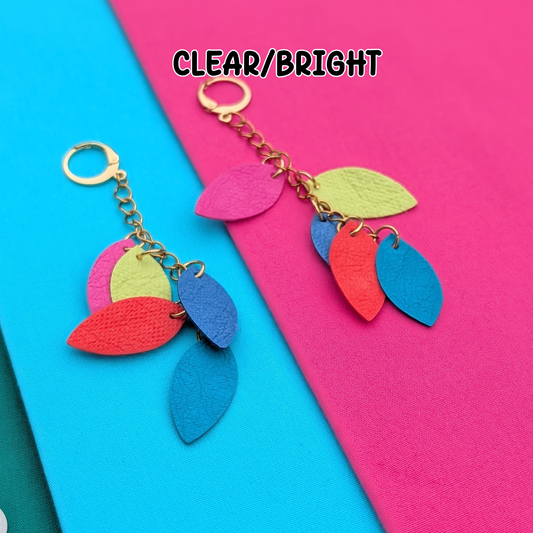 a pair of colorful leather earrings