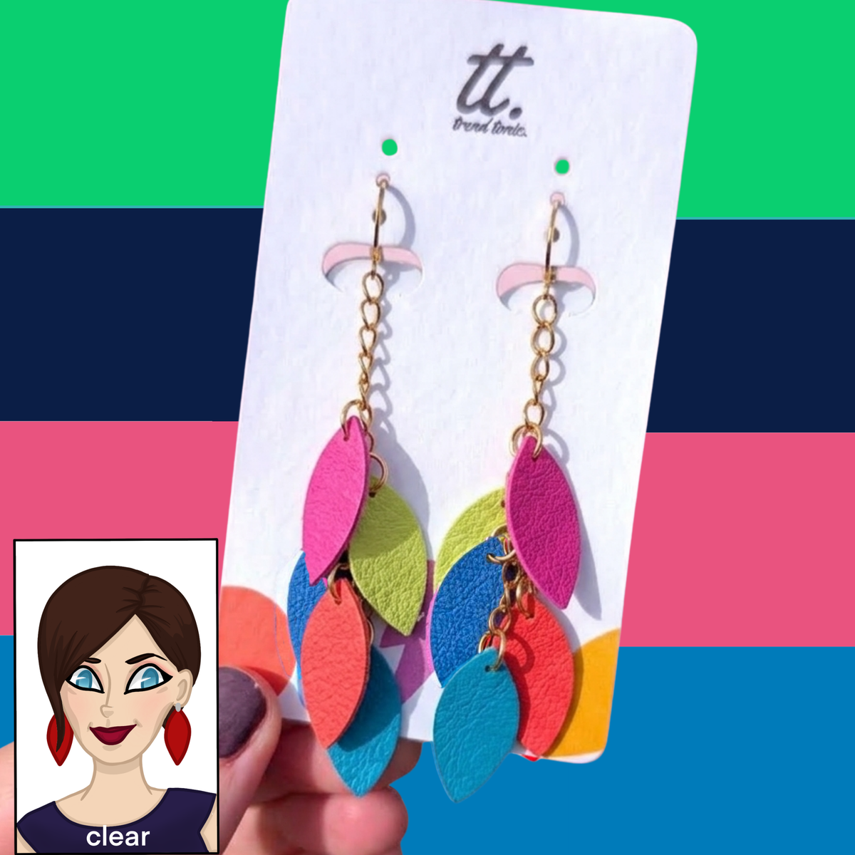 a hand holding a pair of earrings
