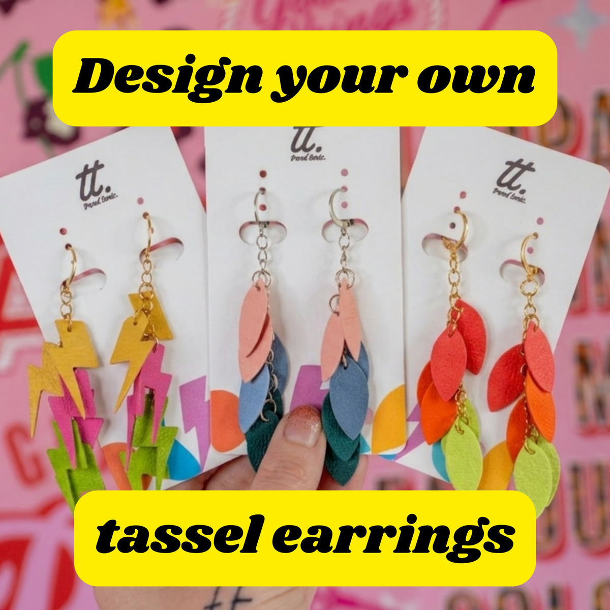 a hand holding a group of earrings