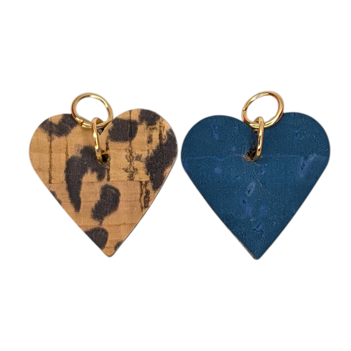 two heart shaped keychains with gold rings