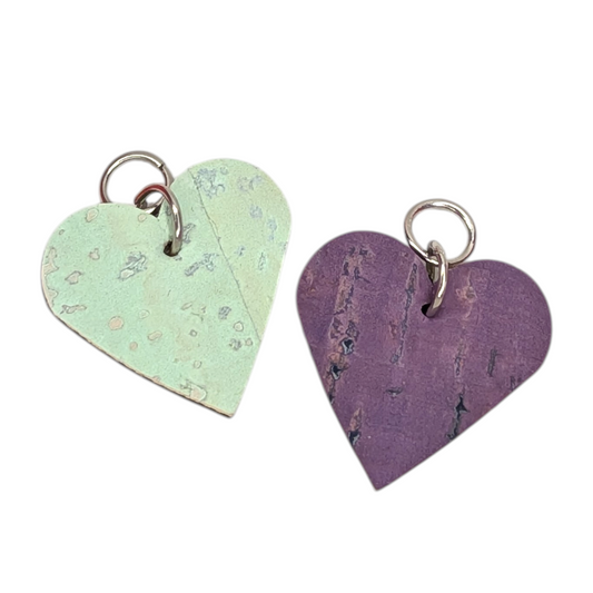 two heart shaped keychains with metal rings