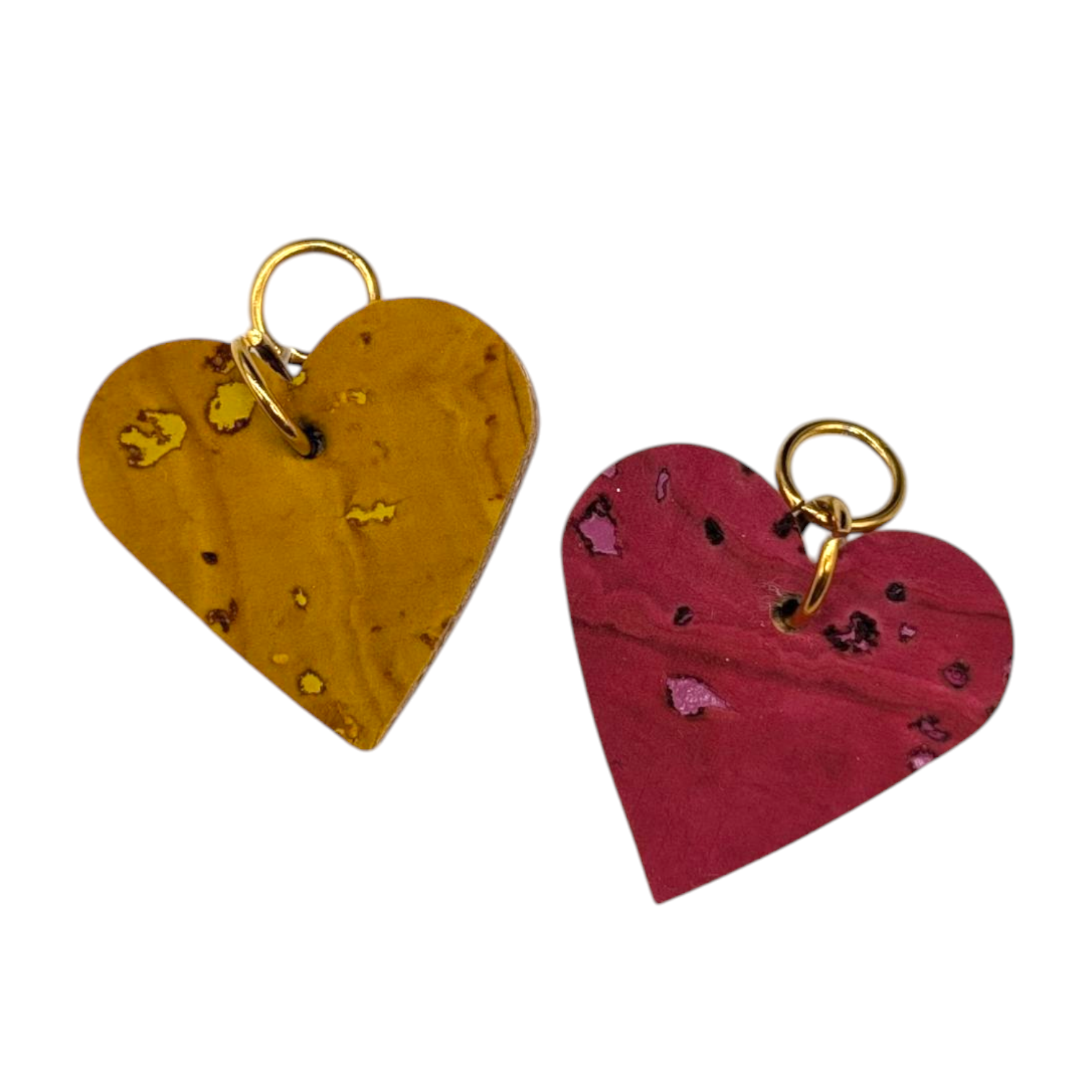two heart shaped keychains with gold rings