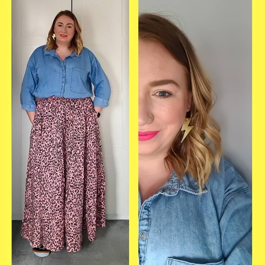 a woman in a blue shirt and a pink leopard skirt