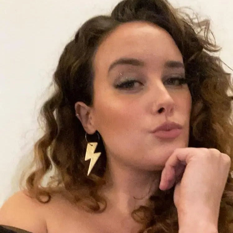 a woman with her hand on her chin