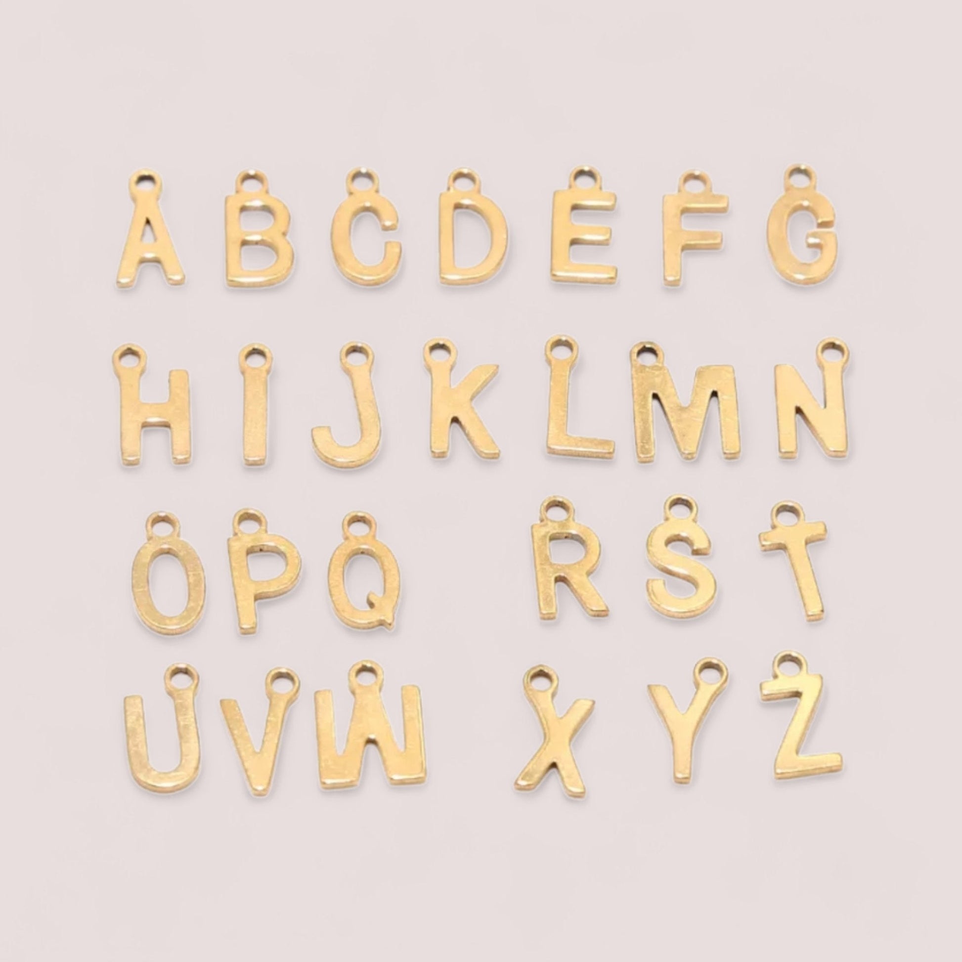 Gold initial letter charm - Trend Tonic