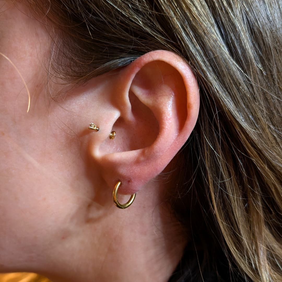 a close up of a woman's ear