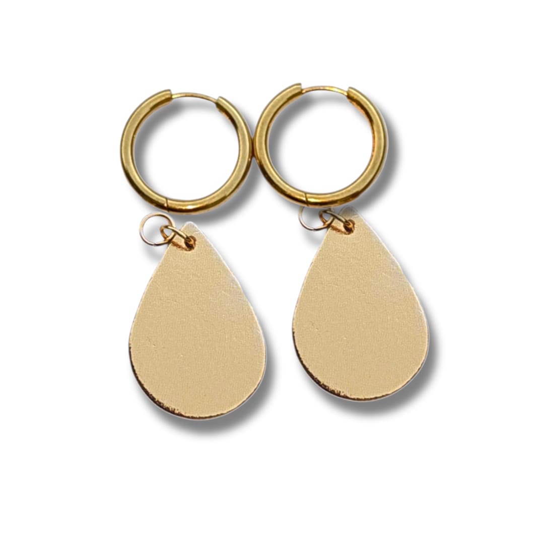 a pair of gold earrings