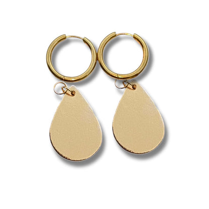 a pair of gold earrings