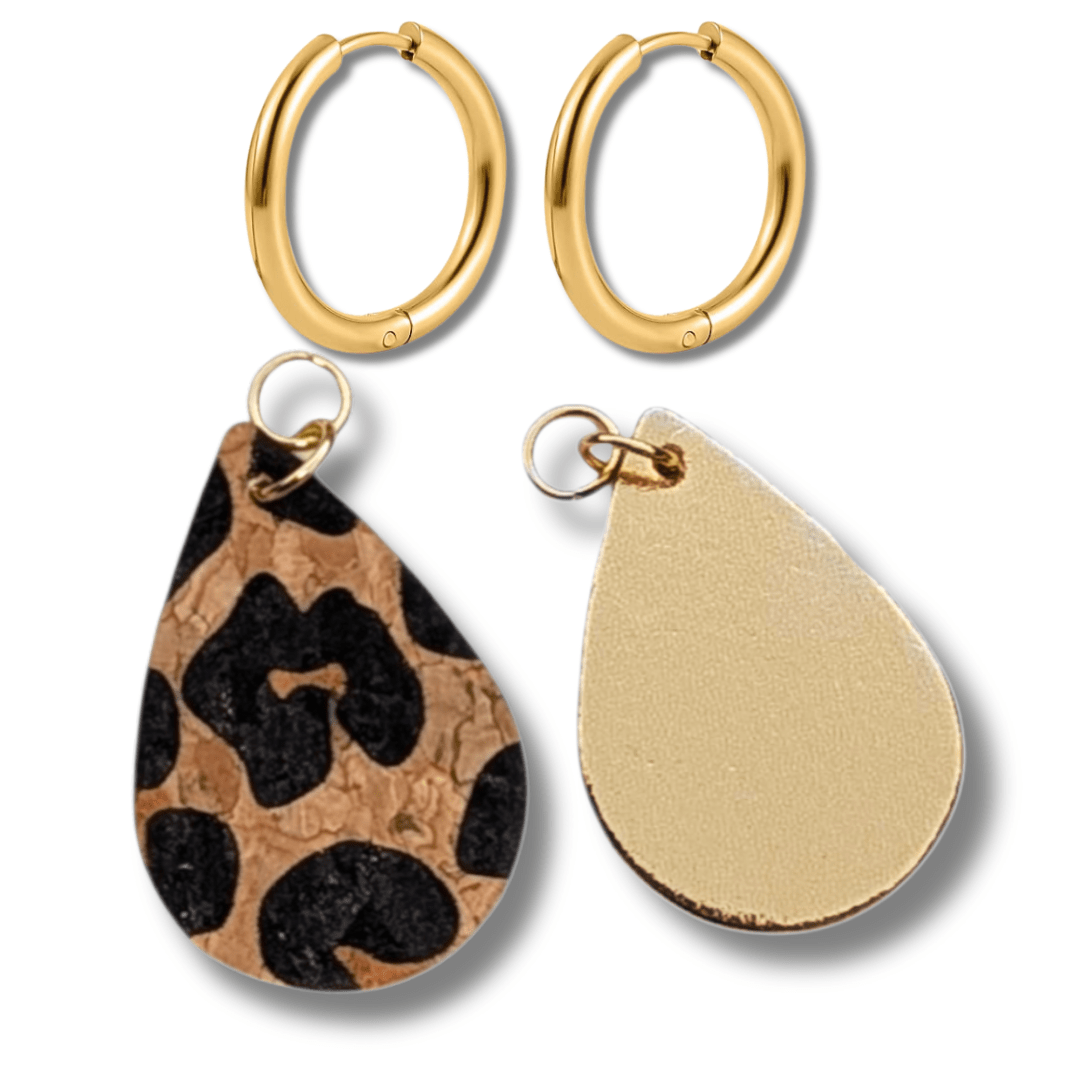 a pair of earrings with leopard print
