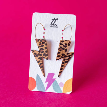 a pair of lightning bolts earrings on a card