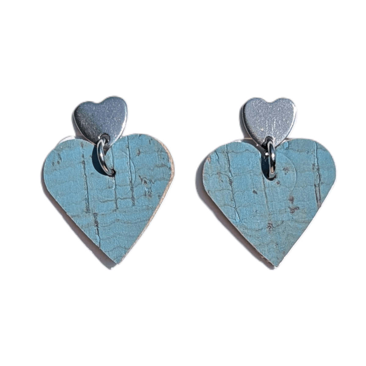 a pair of blue heart shaped earrings