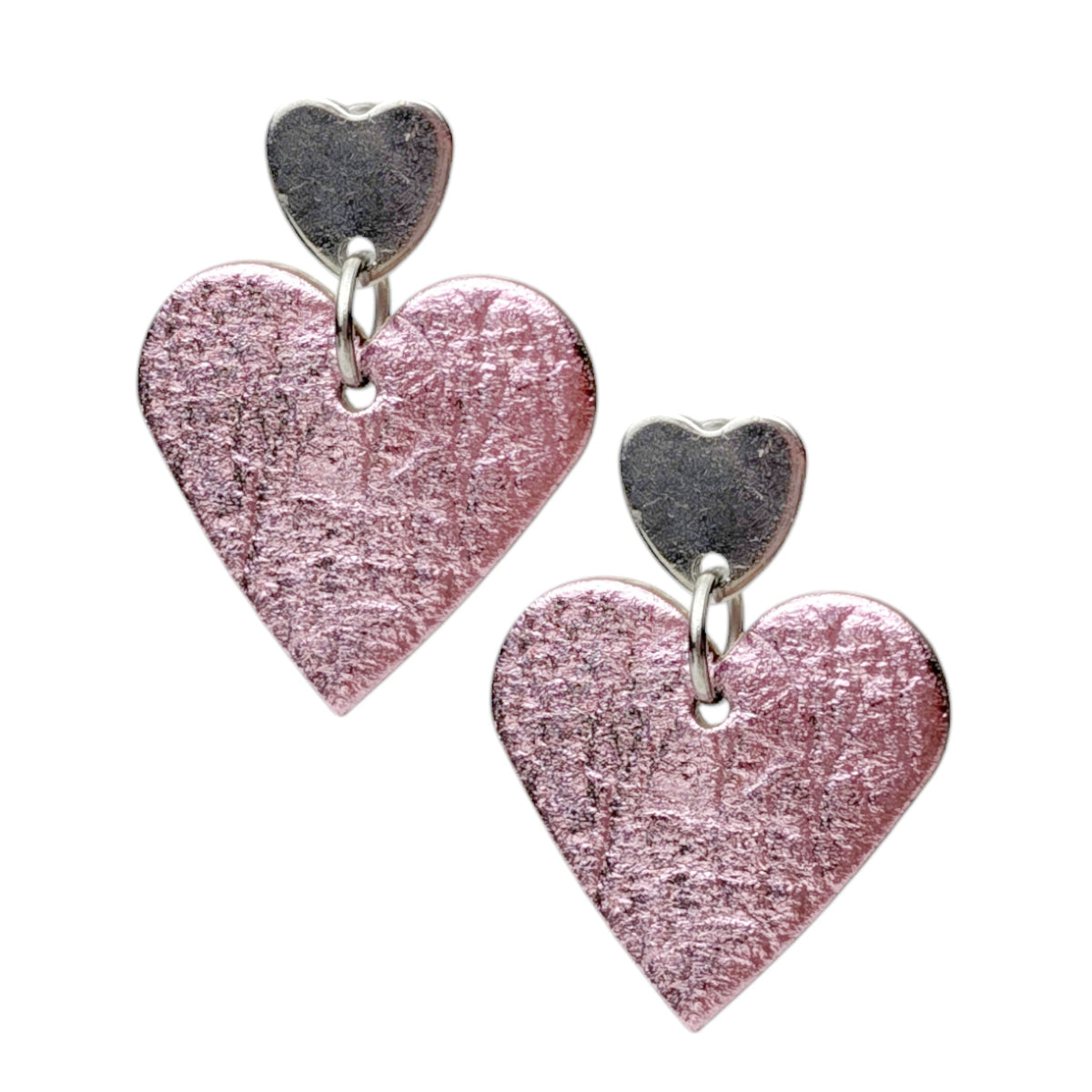 a pair of pink heart shaped earrings