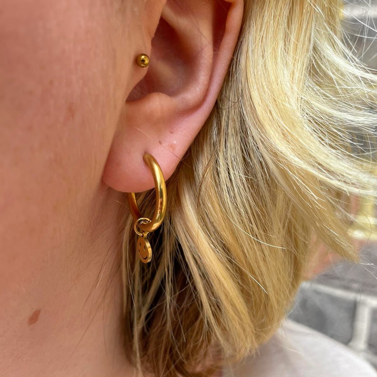 a close up of a woman's ear