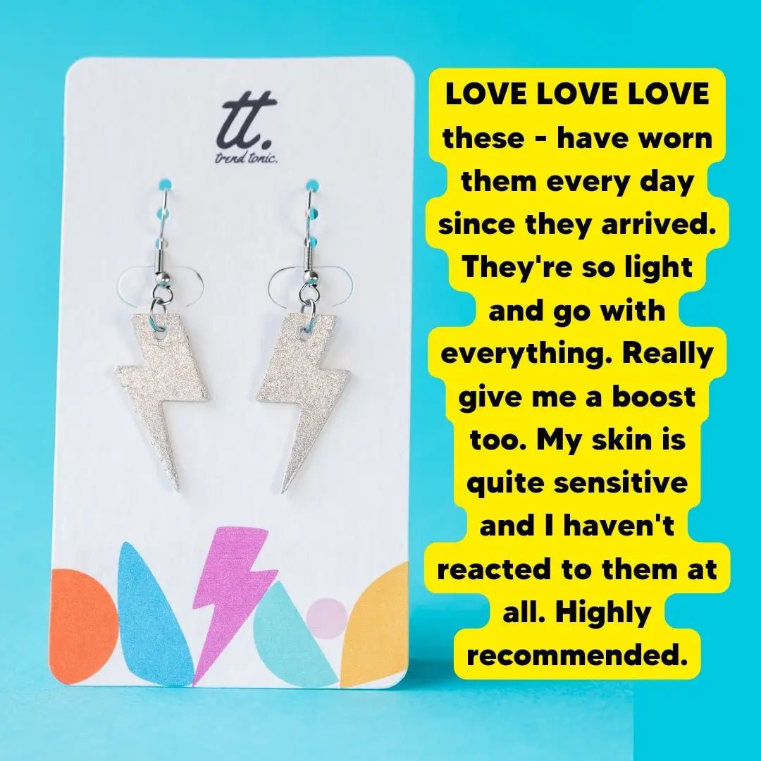 a pair of lightning bolt earrings