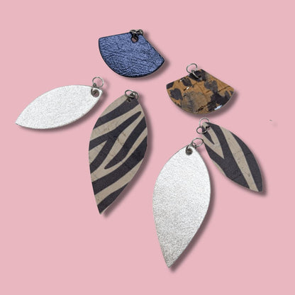 a group of earrings with different shapes