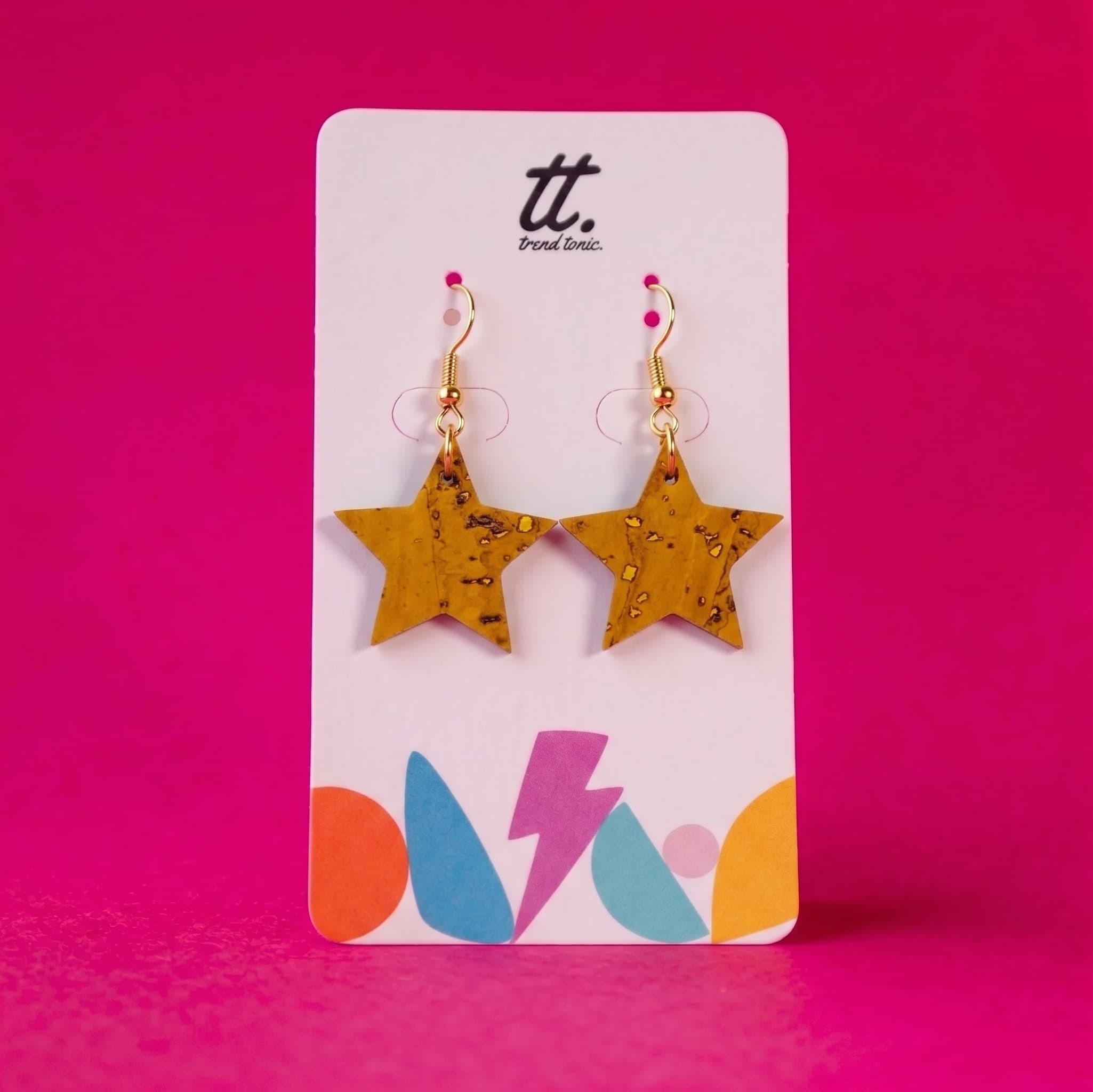 a pair of earrings on a card