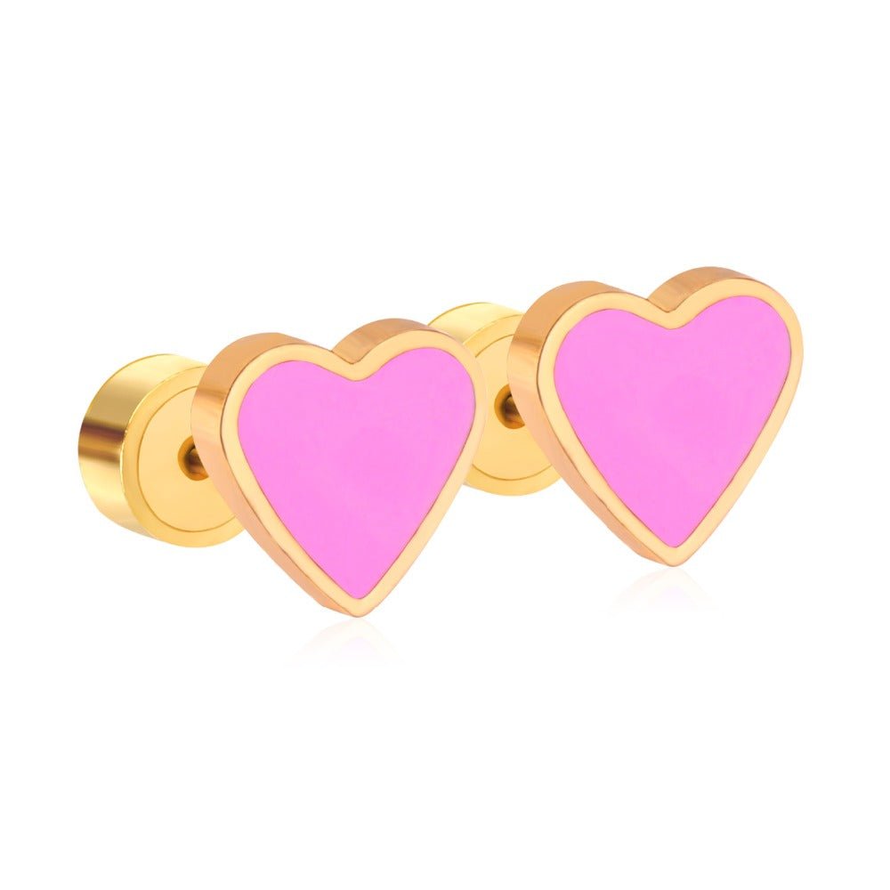 a pair of pink and gold heart shaped earrings