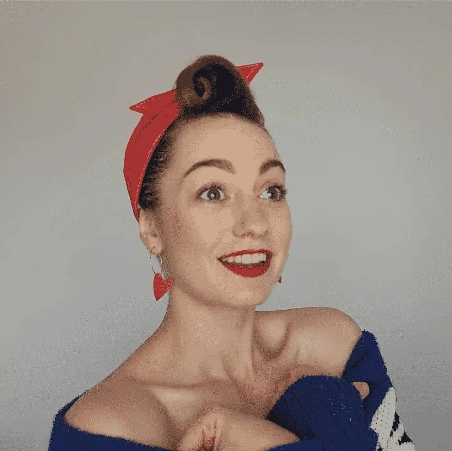 a woman with red hair and a bow on her head