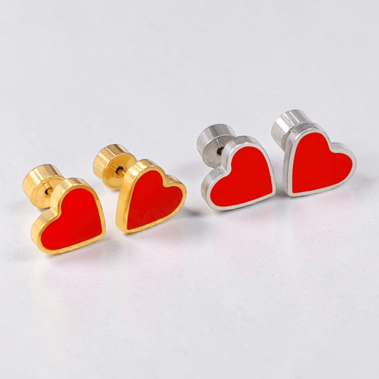 a pair of heart shaped earrings