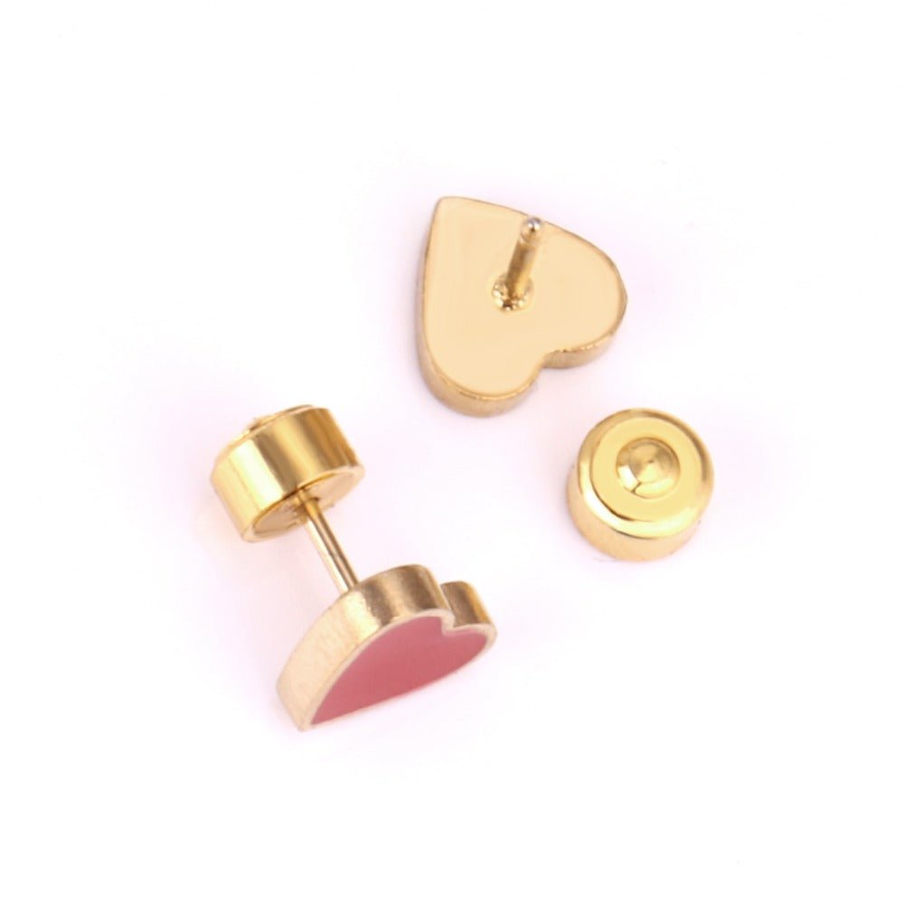 a pair of gold heart shaped earrings