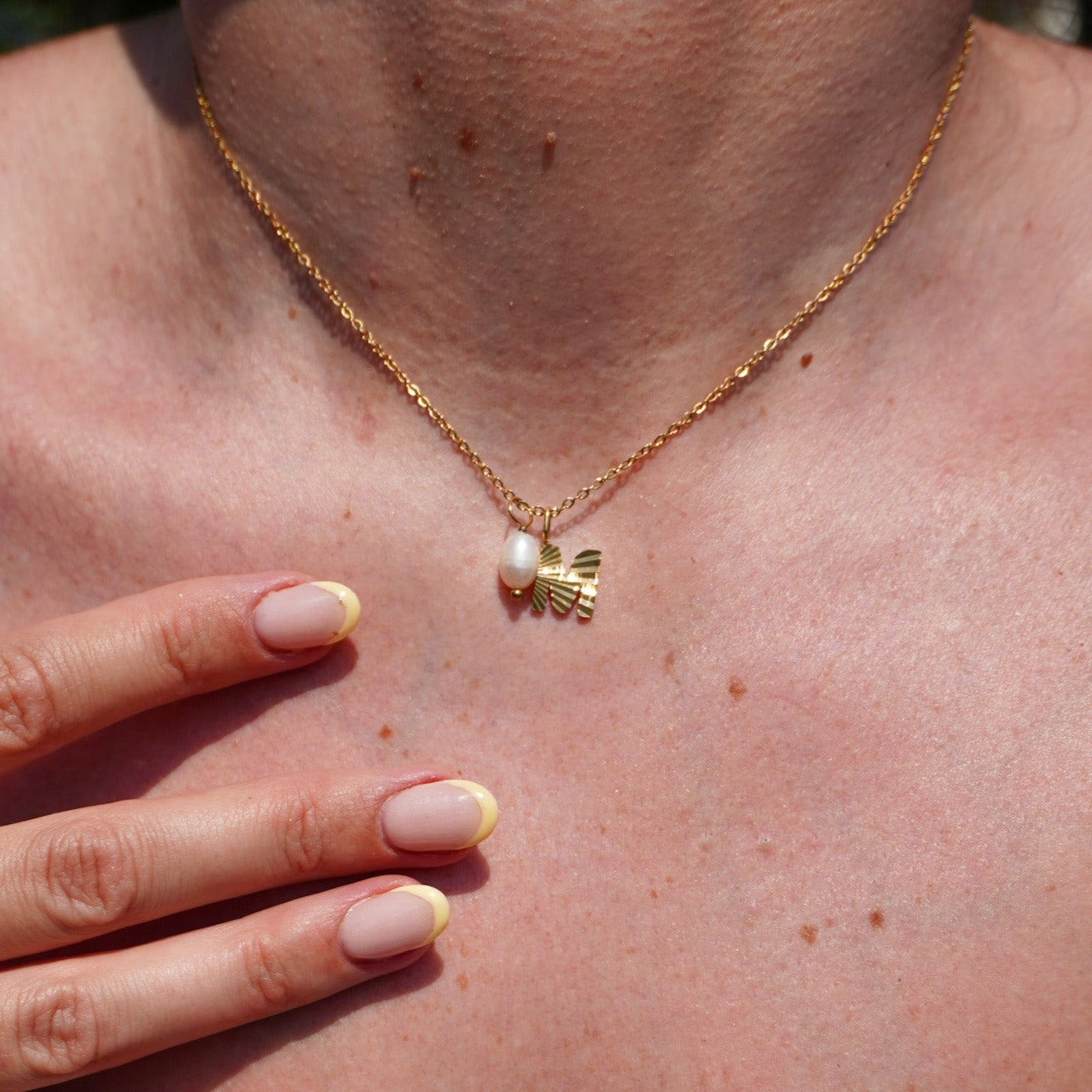 Gold sunbeam initial necklace