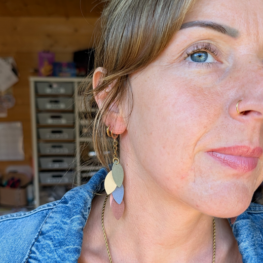 a woman with blue eyes and a nose ring