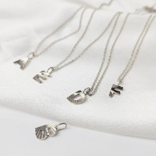 Silver sunbeam initial necklace