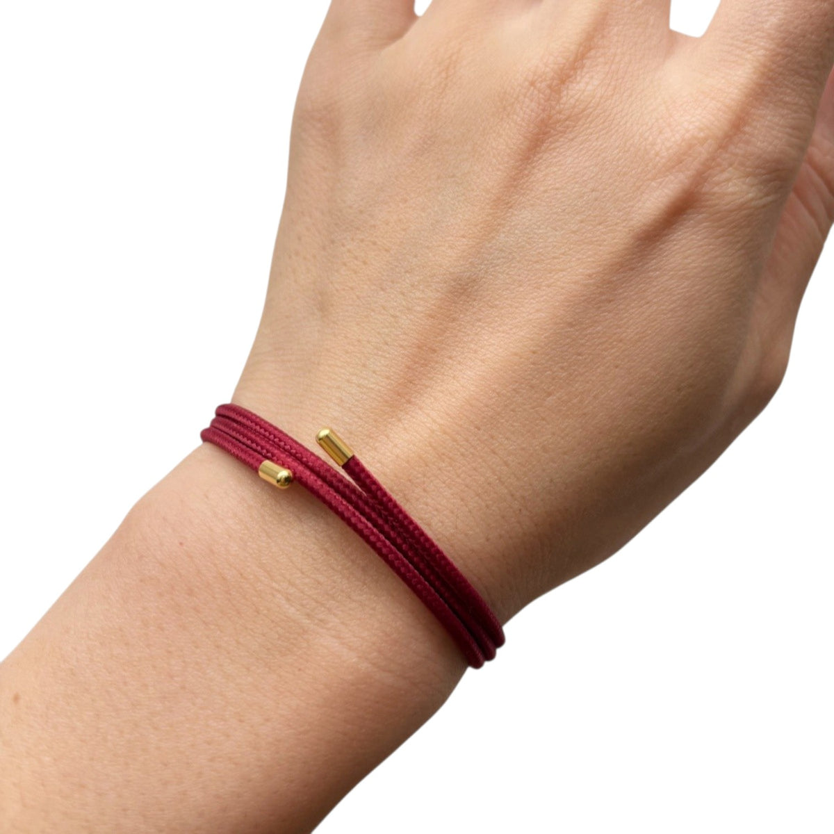 a hand with a red bracelet