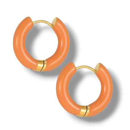 a pair of orange hoop earrings