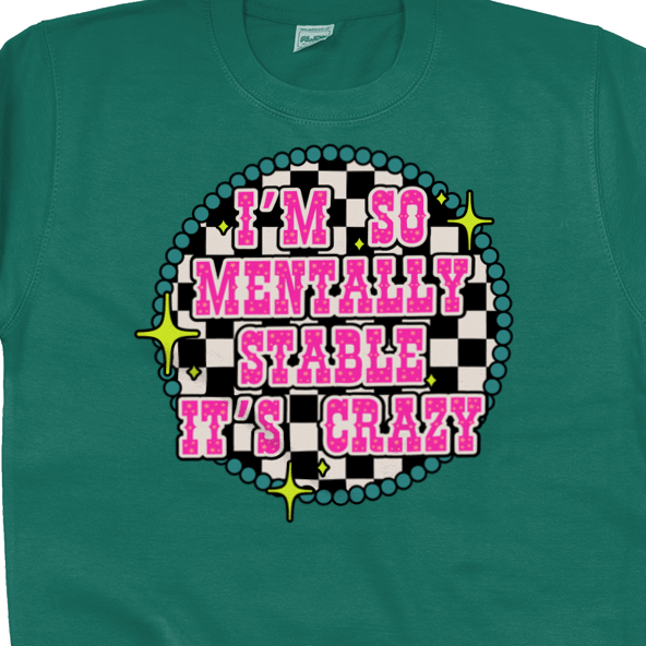 a green shirt with pink and black text