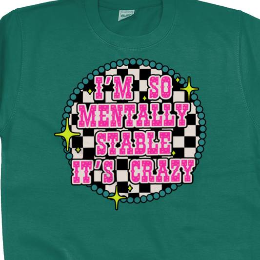 a green shirt with pink and black text