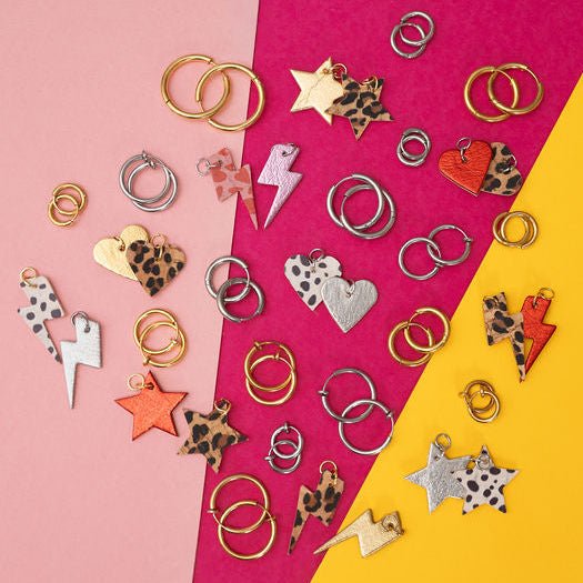 a group of jewelry on a colorful surface