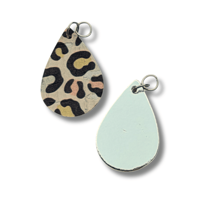 a pair of earrings with animal print
